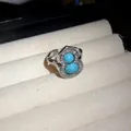 Close-up detail of a silver gourd-shaped ring featuring turquoise stones and crystals. - Ring / Silver-Blue