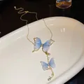 Close-up of blue sheer butterfly necklace with rhinestones and pearls - Tulle Butterfly Tassel Necklace / Blue