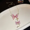 Detail of gold necklace featuring pink tulle butterflies with pearls and rhinestones - Tulle Butterfly Tassel Necklace / Pink