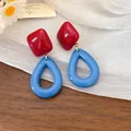 Detail shot of vintage resin earrings with red diamond top and blue teardrop pendant - Silver Earring Post - Red - Blue
