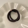 Elegant dark brown leather wrap bracelet featuring rose gold metal end caps for women. - Dark Coffee