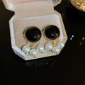 Elegant vintage geometric black stone stud earrings with dangling white imitation pearls - Black Artificial Pearl Studs (HE58)