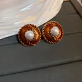 Vintage golden spiral stud earrings with center white pearl and orange resin inlay - Drip Oil with Artificial Pearl (HE60)