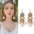 Detailed view of bohemian tassel earrings with leaf charms on an Asian model - Ear Hook (5#) / Gold-White