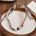 Elegant retro fabric scarf necklace featuring vintage patterns and ceramic beads - White Floral (Three Beads)