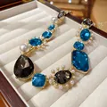 Detail of vintage French luxury necklace with blue crystals and pearls in a box - Necklace / Gold-Blue