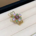 Detailed close-up of elegant flower hair clip with purple gems and gold heart design - Flower Heart Style / Gold Pink (Single)