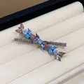 Close-up detail of rhinestone flower hair clip with blue and purple crystals. - Iridescent Floral Design / Gun Black Purple (Single)