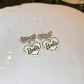 Elegant silver bow earrings featuring a white heart pendant with Barbie logo engraving - Heart Style (18#)
