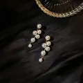 Elegant cluster pearl drop earrings with a golden finish on black silk background - Pearl Style (12#)