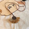 Macro detail of retro Chinese style necklace featuring beige tassels and wood bead accents - Circle Pendant (2#)