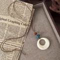 Vintage ethnic style necklace with cream round pendant and blue beads on retro paper - Hollow Circle Pendant (6#)