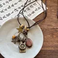 Detailed shot of a vintage ethnic necklace featuring a camera charm and wooden beads - Camera Pendant (9#)