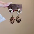 Detailed macro view of bohemian pinecone earrings featuring natural stone beads and petals - Style 12 Ear Hook
