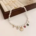 Elegante handgefertigte Perlenkette mit bunten Smiley- und Herzanhängern für Damen - Smiley-Anhänger-Stil (HN1392)