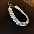 Close-up view of geometric crystal choker necklace with sparkling rectangle rhinestones - Silver