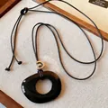 Minimalist black resin hollow circle pendant on brown cord necklace for women - 12# Black Necklace