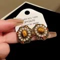 Close-up of vintage style earrings with tiger eye stone, pearls, and orange crystals. - Earring Post Style - Oval Pearl (7#)