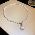 Close-up of mermaid heart pearl necklace with rhinestone border and gold toggle clasp - White (Heart)