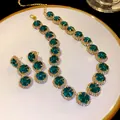 Luxury emerald green jewelry set including necklace and earrings with shimmering rhinestones - Necklace and Earring Set / Gold-Green