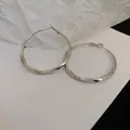 Elegant silver-colored twisted hoop earrings with a sleek high-polish minimalist design - Large Twisted Hoop (33#) / Silver