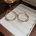 Elegant golden twisted hoop earrings with pave cubic zirconia in a wooden jewelry box - Zirconia Spiral Wrapped Style (53#) / Gold