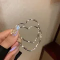 Minimalist oversized silver-toned heart-shaped hoop earrings for a stylish look - Twisted Heart Style (99#) / Silver