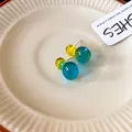 Elegant minimalist resin jelly gourd stud earrings in yellow and teal with silver needles. - Gourd (HE22133) / Blue-Yellow