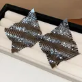 Detailed macro shot of luxury metallic mesh square stud earrings displayed in a jewelry tray - Silver Post Square Mesh Style / Gunmetal