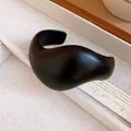 Close-up of minimalist matte black acrylic open cuff bangle with sculptural design. - Irregular Streamlined Style (5#) / Black