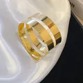 Close-up of a high-shine gold metallic open cuff bracelet with irregular geometric design - Triple Layer Geometric (11#)
