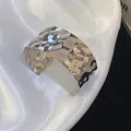 Macro view of the shiny silver crumpled metallic cuff bracelet with irregular texture. - Irregular Pleated Geometric (2#) / Silver