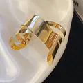 Detailed close-up of shiny gold irregular geometric cuff bracelet on elegant white silk cloth - Multi-layer Stacked (6#)