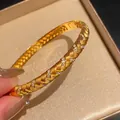Elegant gold-plated braided bangle bracelet featuring sparkling zircon stones for women - Braided Texture Oval Bangle (HB5845) / Gold