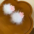 Detailed top view of white fur pom-pom earrings with pink cherry blossom accents - 8# Silver Post Style / Pink and White