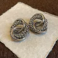 Detailed macro shot of silver knotted hoop stud earrings with unique beaded texture. - 110# Silver Needle-Silver-Knot-Granular Texture