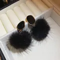Close-up of black fur ball earrings with gold-framed studs in a jewelry box - 31# Silver Needle Style / Gold/Black