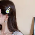 Cute yellow and white plumeria flower duckbill hair clip worn on a woman's side hair. - 11# BB Clip - Plumeria