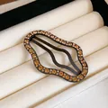 Elegant wavy metal hair clip adorned with sparkling amber rhinestones on velvet - 35# BB Clip - Wavy Rhinestone Style