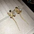 Exquisite 18K gold plated butterfly tassel ear clips with green zircon and shell inlay - Gold