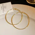Elegant and minimalist large gold-toned metallic hoop earrings for women with high-shine finish - Classic Hoop Style (28#) / 7cm Extra Large / Gold