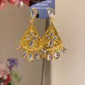 Detail of luxury gold tassel earrings with shimmering teardrop cubic zirconia stones. - Gold (33#)