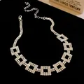 Macro detail of shimmering rhinestone square geometric links on silver clavicle chain - Double-layer Square Geometric Clavicle Chain / Silver