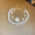 Elegant French minimalist pearl bracelet set featuring a white camellia flower charm - Camellia Two-Piece Style / Gold