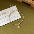 Bohemian holiday beaded bracelet featuring natural stones, pearls and a silver starfish charm - Bracelet / Brown Starfish Style 19