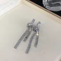 Detailed view of silver drop earrings with shimmering cubic zirconia tassels - Knot Tassel Style (1#)