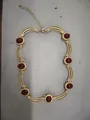Vintage gold-tone choker necklace with oval red gemstones and an adjustable chain. - Necklace / Gold-Red