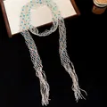 Exaggerated vintage glass beaded hollow long necklace with blue accents and tassel details - Necklace / Gold-Blue