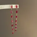 Close-up of retro red crystal drop earrings with long gold chain and organic red beads. - Silver Earring Post Style / Gold Pink Combination