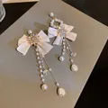 Elegant French-style tassel earrings with pearls, crystals, and white ribbon bows - 41# Silver Needle - Standard - Gauze - Off-white